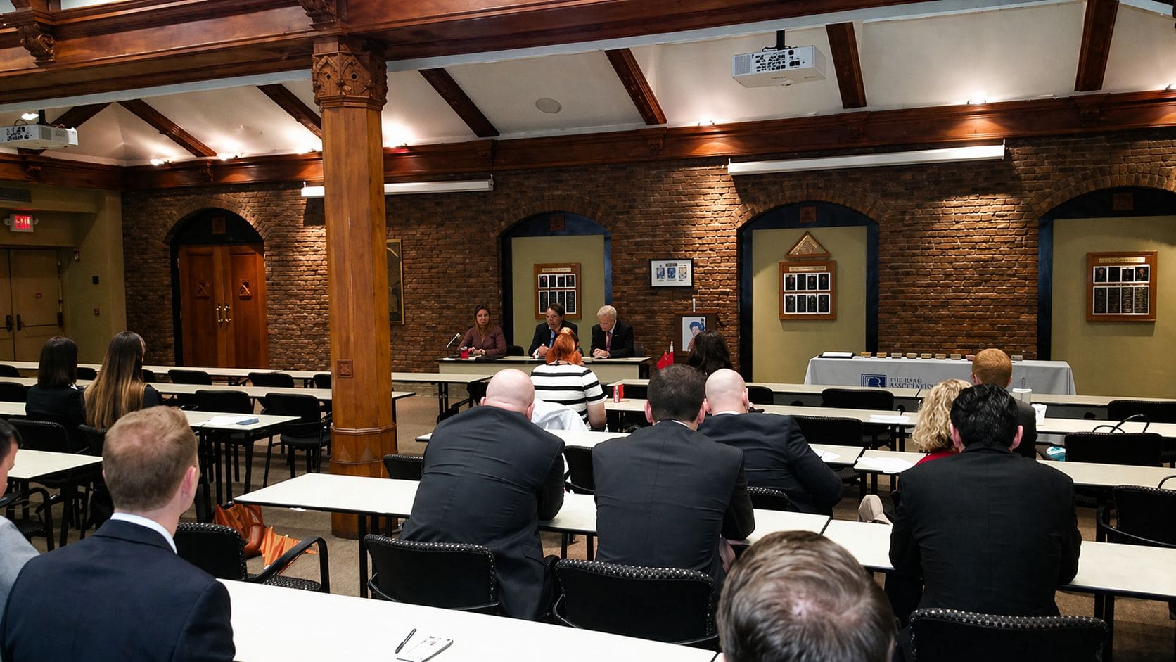 Attendees seated at tables during a bar association program